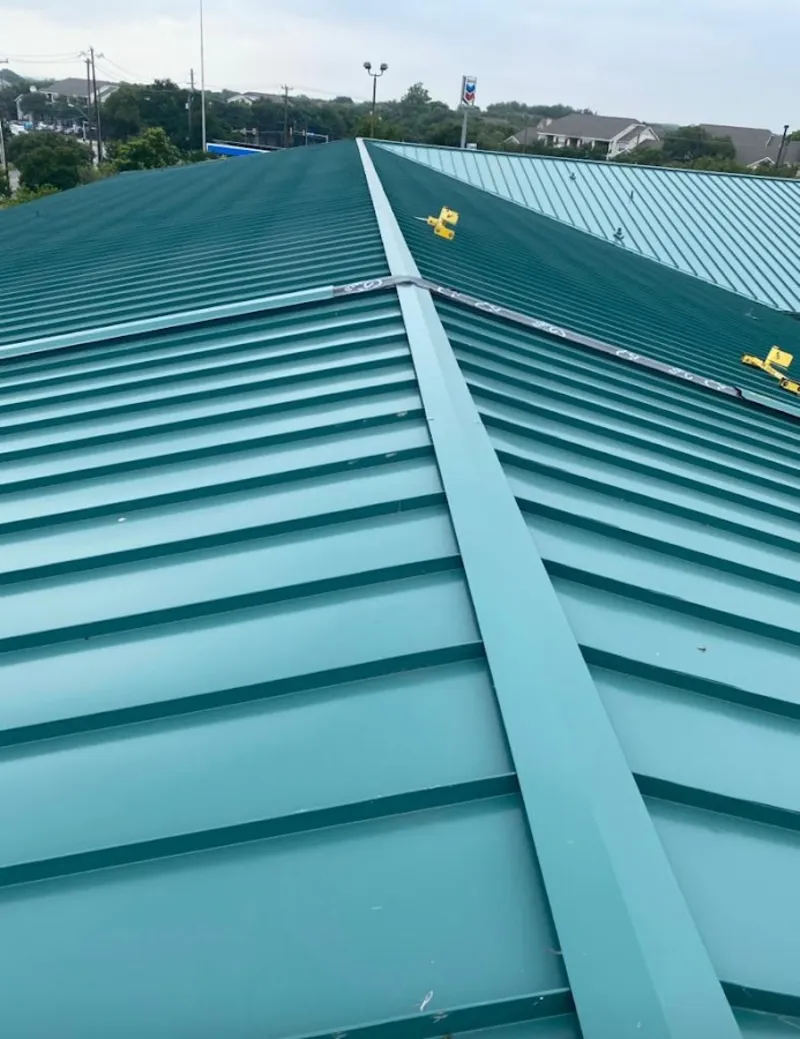 Green commercial metal roof ridge and valley for Metal Roof Repair in Ives Estates